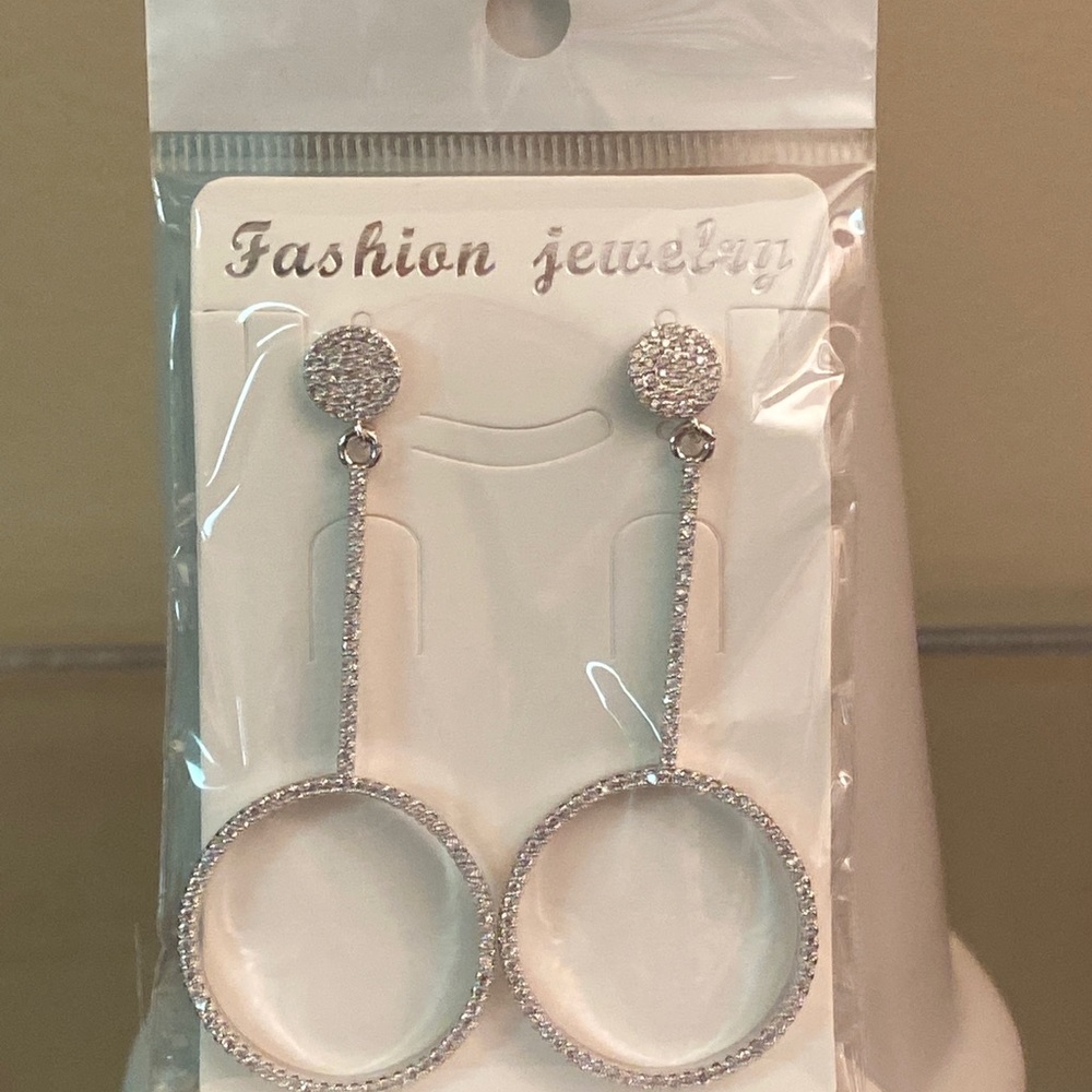 Circle drop silver crystal earrings. 2 3/4 drop .